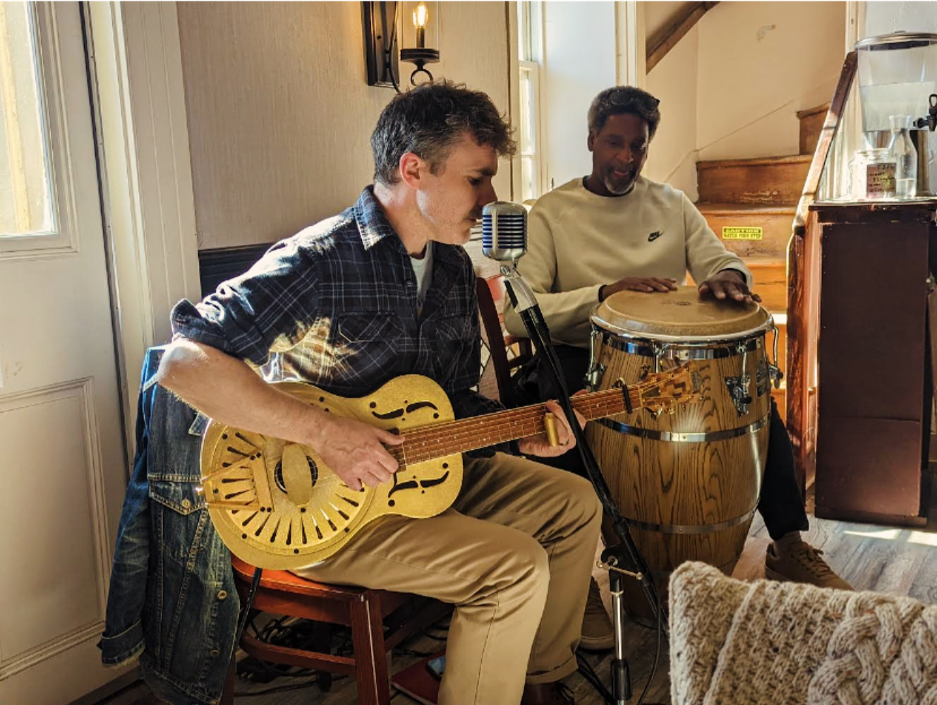Cody Summit performing acoustic music in an intimate setting